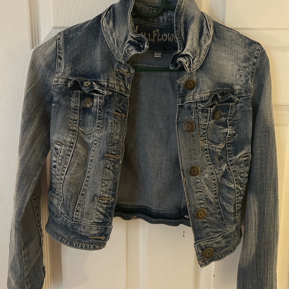 This is a like new Jean jacket from wallflower. Size small. Distress look